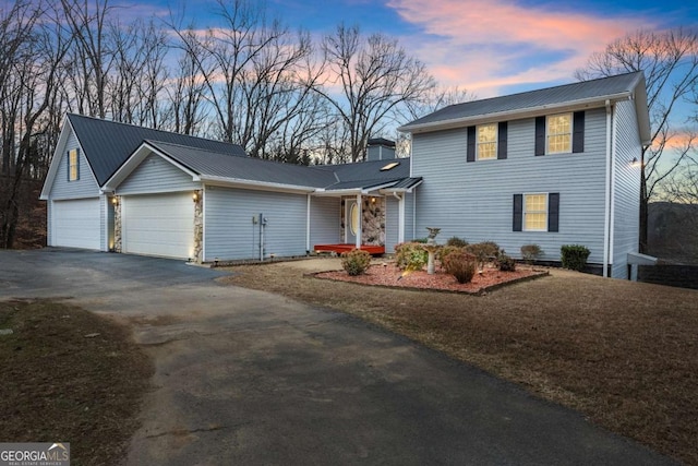 3366 Small Woods Ln, Gainesville, GA 30506 - traditional-style home with metal roof, aphalt driveway, and a garage