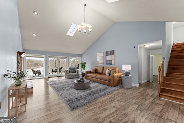 3366 Small Woods Ln, Gainesville, GA 30506 - living room with a skylight, wood finished floors, high vaulted ceiling, stairway, and baseboards