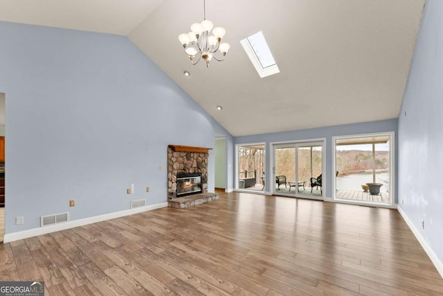 3366 Small Woods Ln, Gainesville, GA 30506 - unfurnished living room featuring wood finished floors, visible vents, a skylight, and high vaulted ceiling