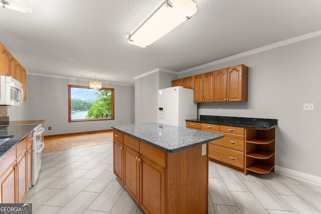 3366 Small Woods Ln, Gainesville, GA 30506 - kitchen featuring white appliances, crown molding, a kitchen island, brown cabinets, and a textured ceiling