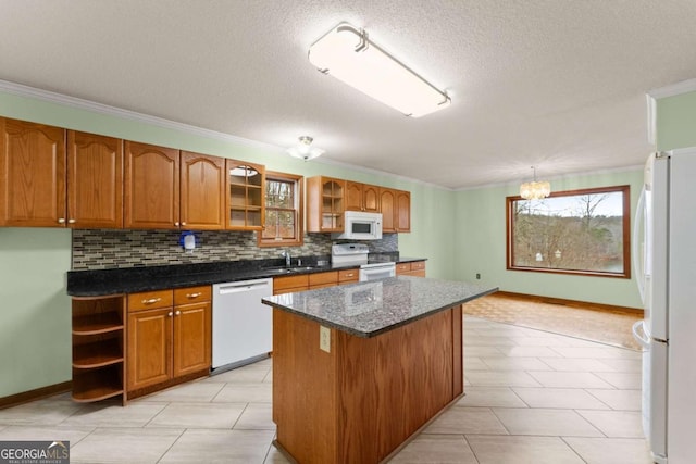 3366 Small Woods Ln, Gainesville, GA 30506 - kitchen featuring brown cabinets, white appliances, tasteful backsplash, and a kitchen island