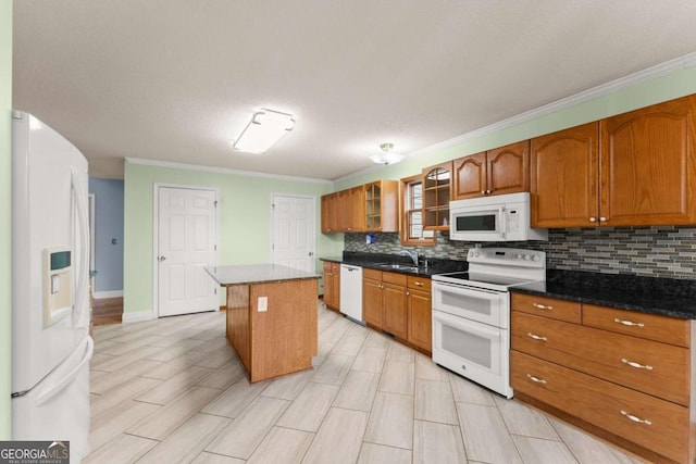 3366 Small Woods Ln, Gainesville, GA 30506 - kitchen featuring white appliances, brown cabinets, crown molding, backsplash, and a kitchen island