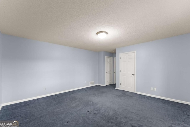 3366 Small Woods Ln, Gainesville, GA 30506 - empty room with a textured ceiling, visible vents, baseboards, and dark colored carpet