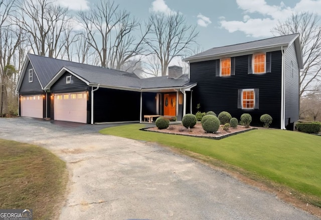 3366 Small Woods Ln, Gainesville, GA 30506 - view of front of house featuring an attached garage, a chimney, a front lawn, and aphalt driveway