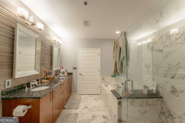 bathroom featuring vanity and a shower with door