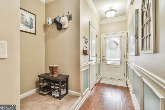 entryway featuring hardwood / wood-style flooring and crown molding