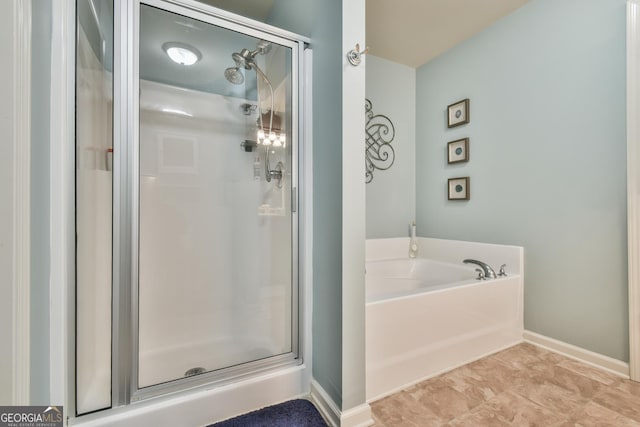 bathroom with separate shower and tub