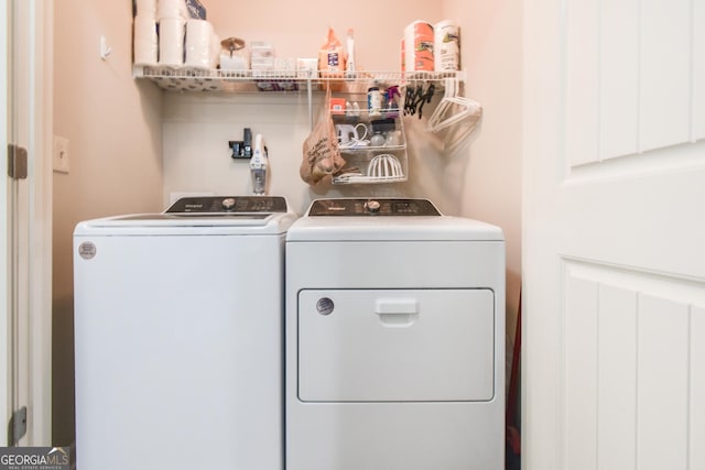 washroom featuring washer and dryer