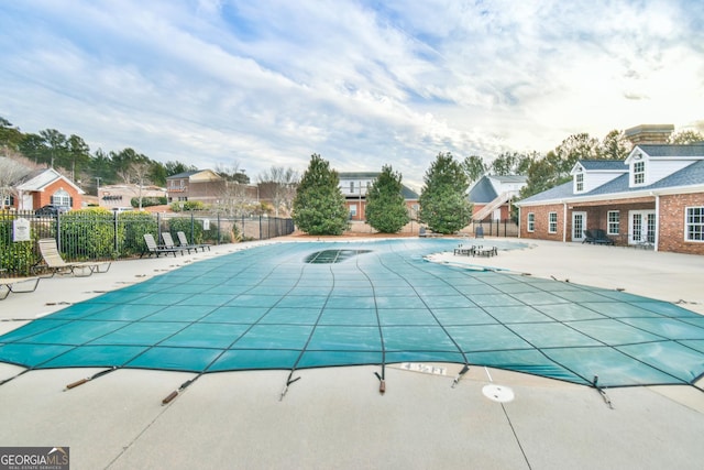 view of swimming pool with a patio area