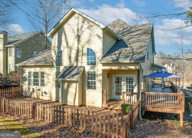 rear view of house with a wooden deck