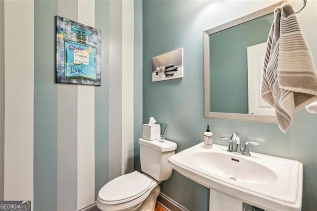 bathroom with sink and toilet