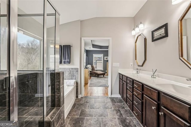 bathroom featuring vanity and separate shower and tub