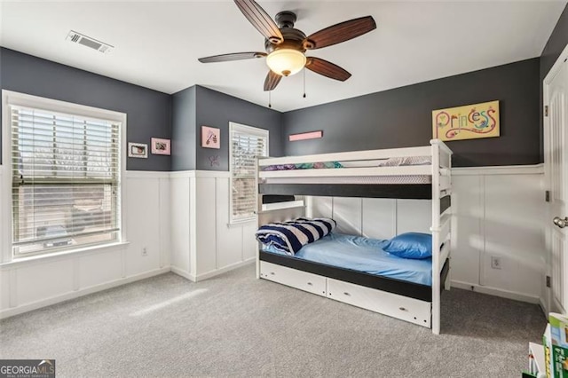 carpeted bedroom featuring ceiling fan