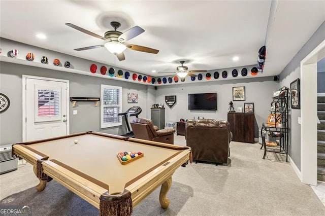 rec room with pool table, light colored carpet, and ceiling fan