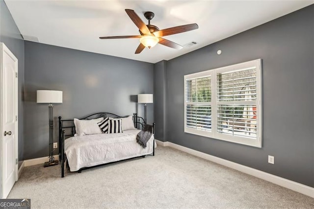 carpeted bedroom with ceiling fan