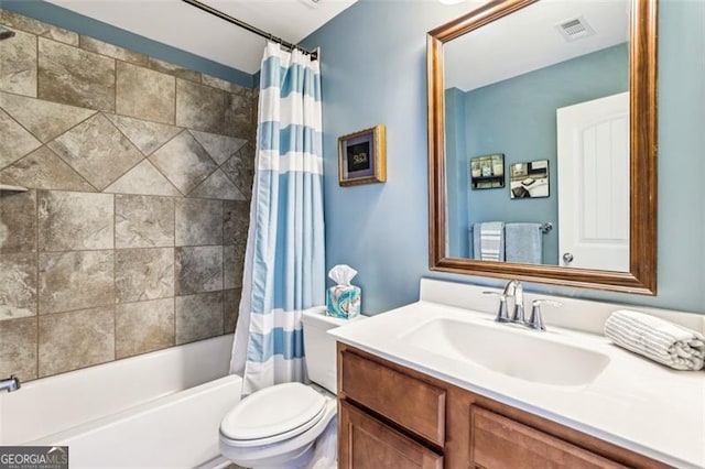 full bathroom with shower / tub combo with curtain, vanity, and toilet