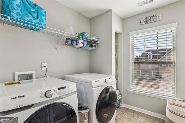 laundry room featuring washer and dryer