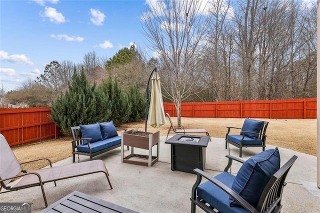 view of patio / terrace featuring an outdoor living space with a fire pit