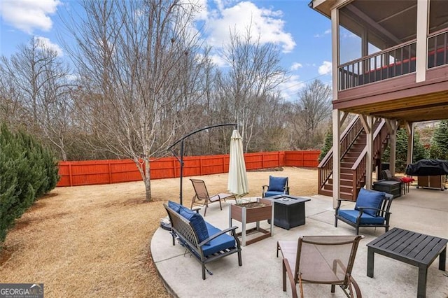 view of patio featuring a fire pit