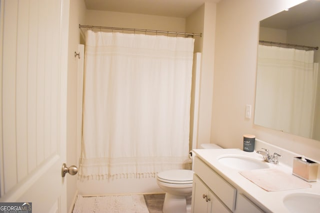 full bathroom featuring vanity, toilet, and shower / bathtub combination with curtain