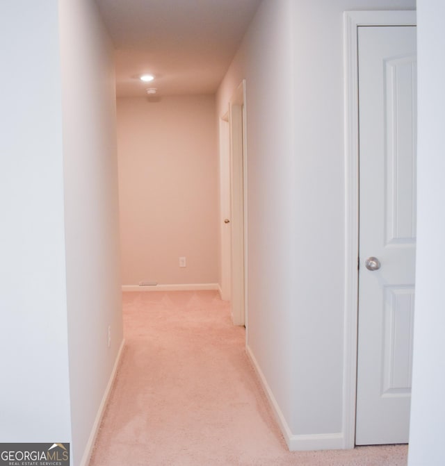 hallway with light carpet