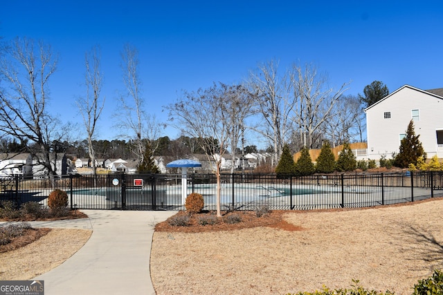 surrounding community with a swimming pool