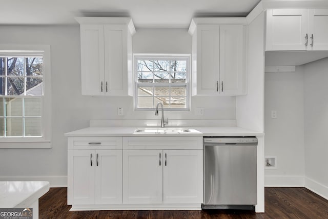 kitchen with white cabinetry, dishwasher, plenty of natural light, and sink