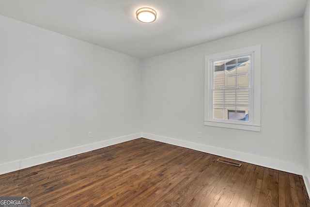 unfurnished room featuring hardwood / wood-style flooring