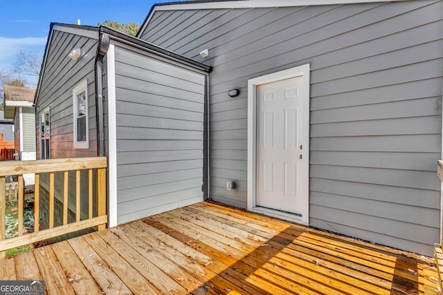 doorway to property with a wooden deck