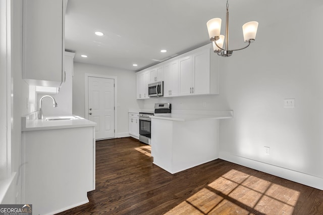 kitchen featuring sink, dark wood-type flooring, stainless steel appliances, and white cabinets