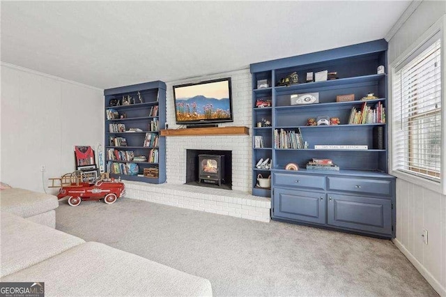 carpeted living room featuring built in shelves