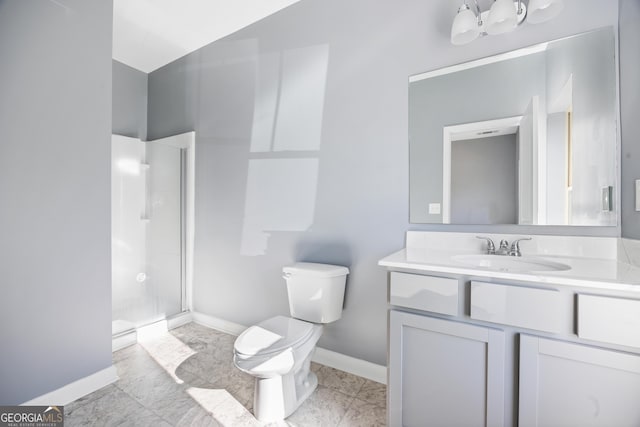 bathroom with vanity, an enclosed shower, and toilet