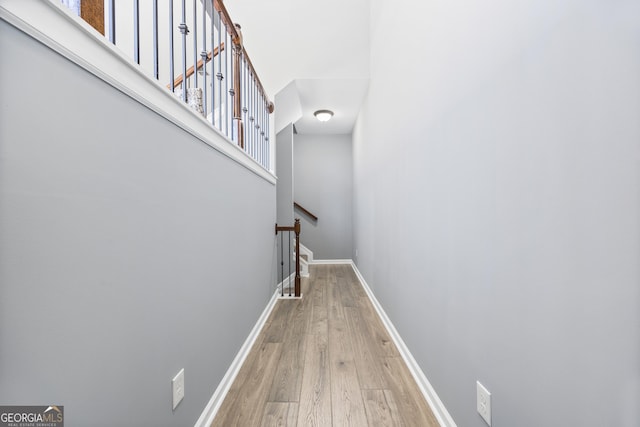 stairs with hardwood / wood-style flooring