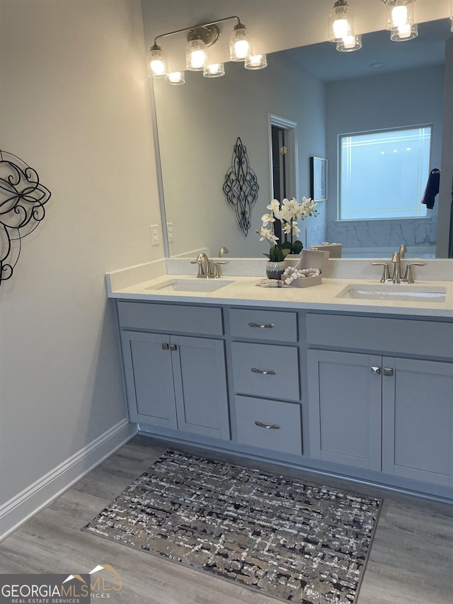 bathroom featuring vanity and hardwood / wood-style flooring