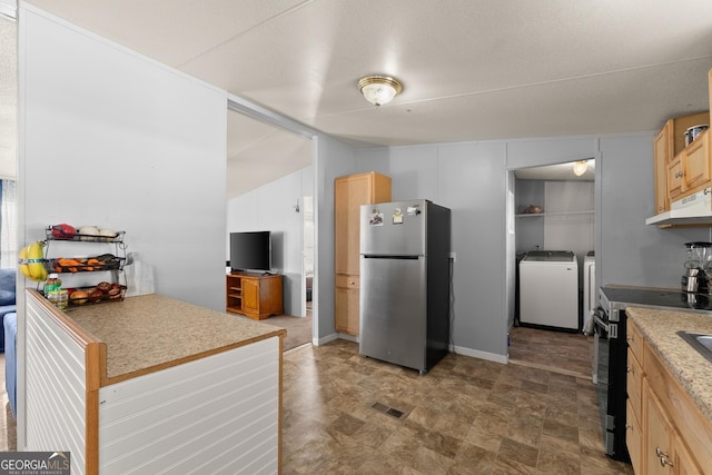 kitchen with stainless steel appliances, washing machine and clothes dryer, and light brown cabinetry