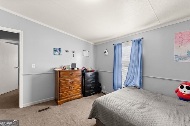 carpeted bedroom featuring vaulted ceiling