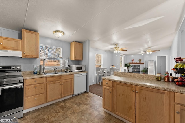 kitchen with dishwasher, sink, stainless steel range with electric stovetop, ceiling fan, and a textured ceiling