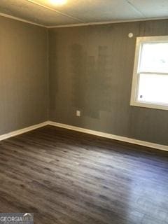 3388 Majestic Ln, Macon, GA 31217 - empty room with dark wood finished floors and baseboards