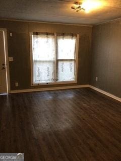 3388 Majestic Ln, Macon, GA 31217 - spare room with dark wood-type flooring and baseboards
