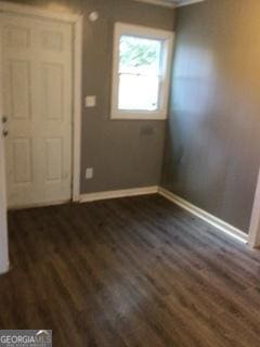 3388 Majestic Ln, Macon, GA 31217 - entrance foyer with baseboards, dark wood-style flooring, and ornamental molding