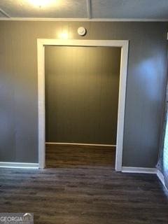 3388 Majestic Ln, Macon, GA 31217 - unfurnished dining area featuring dark wood-style floors, baseboards, and crown molding