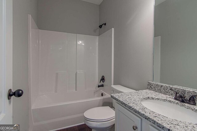 full bathroom with vanity, bathing tub / shower combination, and toilet