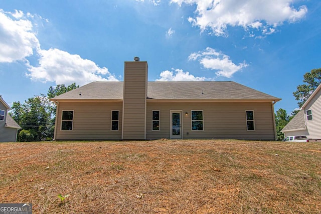 back of house with a yard