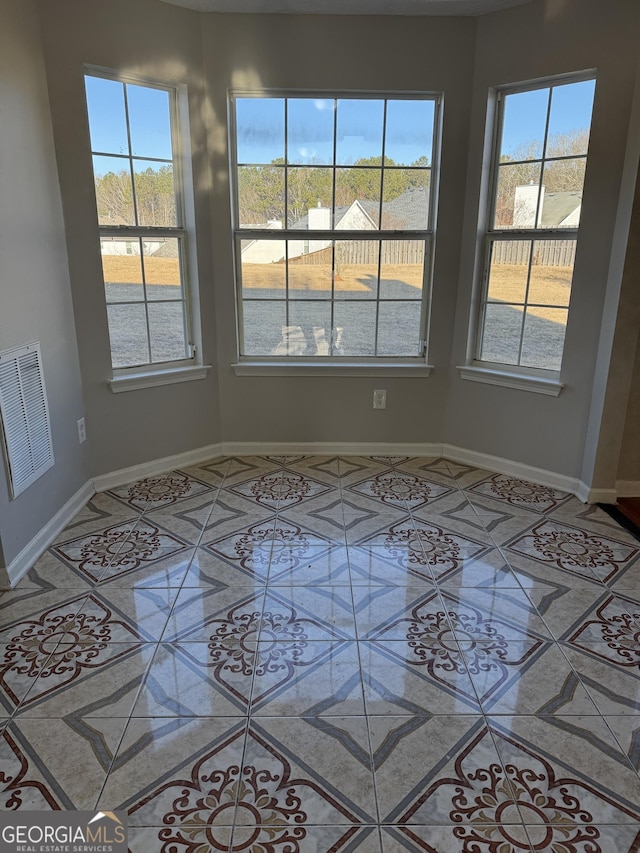 empty room featuring tile patterned flooring