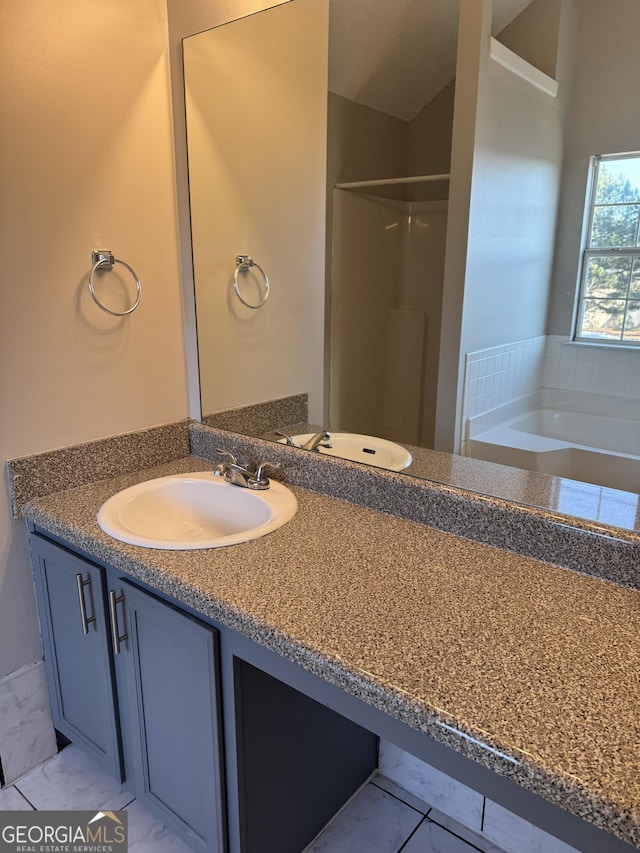 bathroom with plus walk in shower and vanity