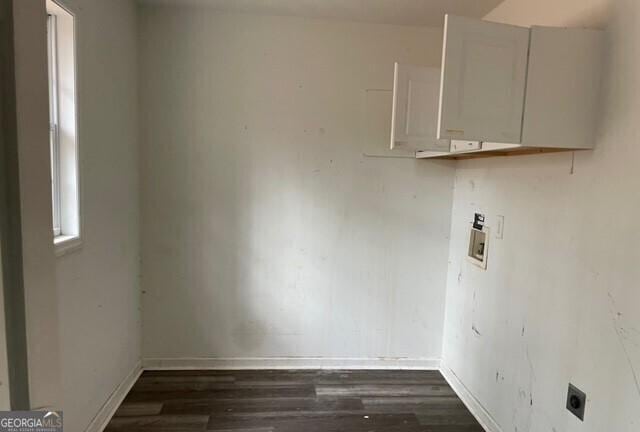 washroom with dark hardwood / wood-style floors, hookup for an electric dryer, and hookup for a washing machine