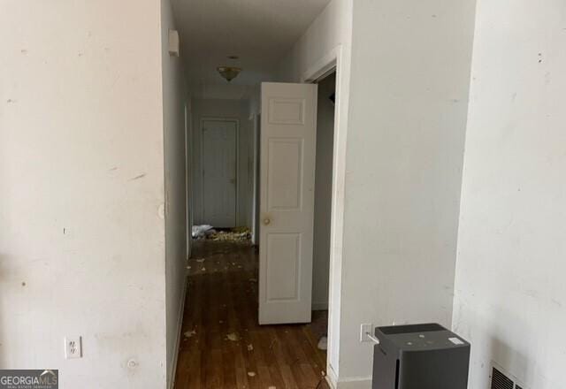 corridor with dark hardwood / wood-style floors