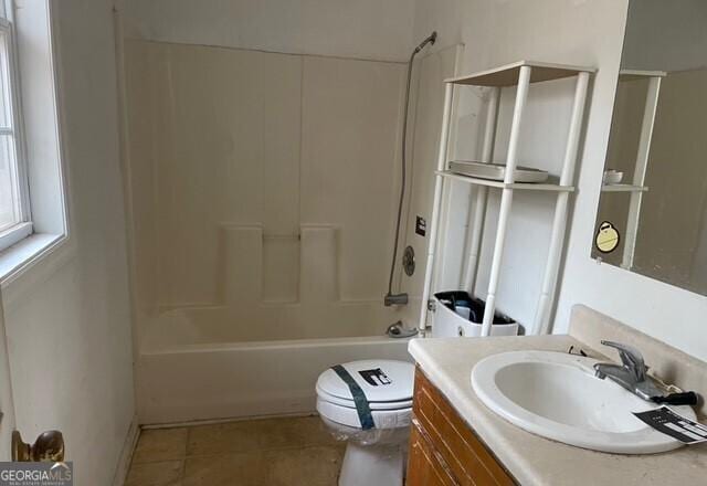 full bathroom with vanity, tile patterned flooring, shower / bathtub combination, and toilet