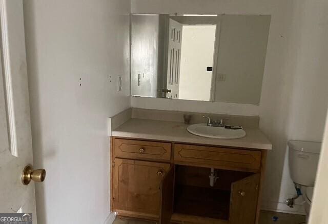 bathroom with vanity and toilet