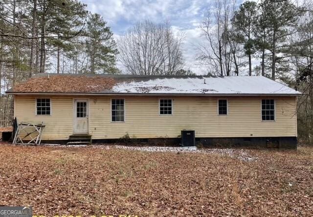 rear view of property with central air condition unit